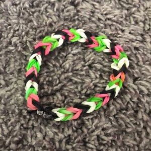 PINK BLACK WHITE AND GREEN RUBBER BAND BRACELET